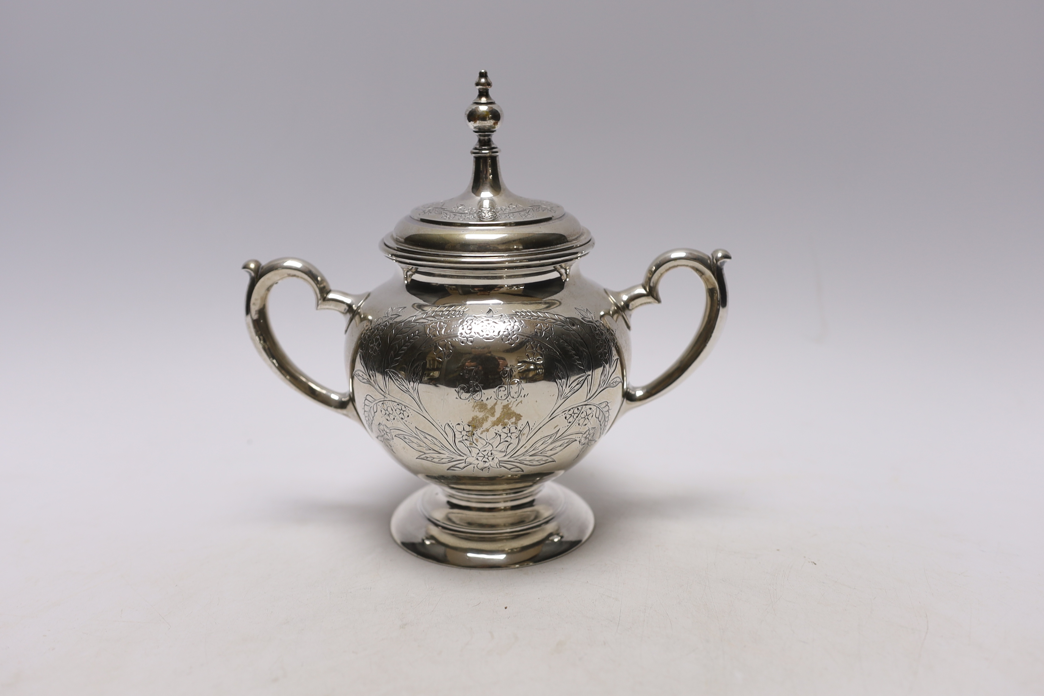 A late 19th century Russian 84 zolotnik two handled sugar bowl and hinged cover, unknown assay master, Moscow, 1883, height 18cm, 12.5oz.